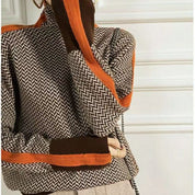 Rolling collar sweater with a geometric knitting pattern-3